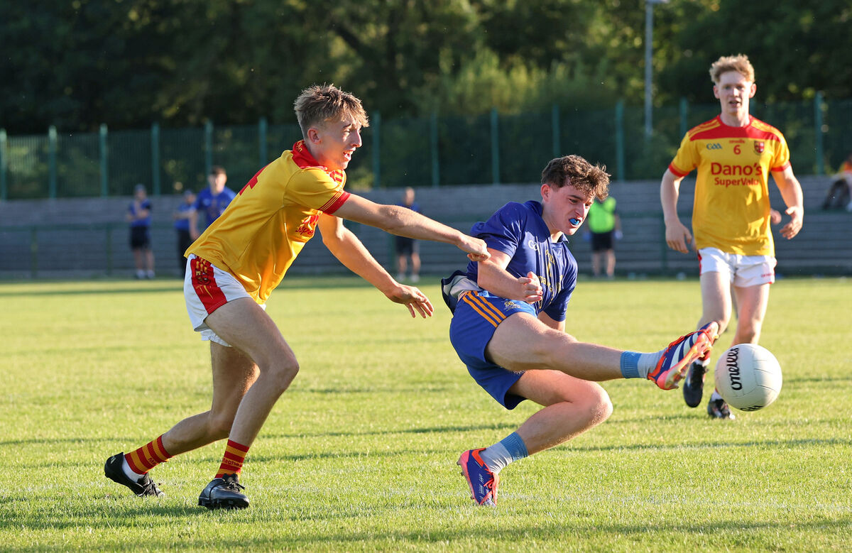 Charlie Galvin, St Finbarrs, under pressure from Thomais Britton, Mallow. Picture: Jim Coughlan.