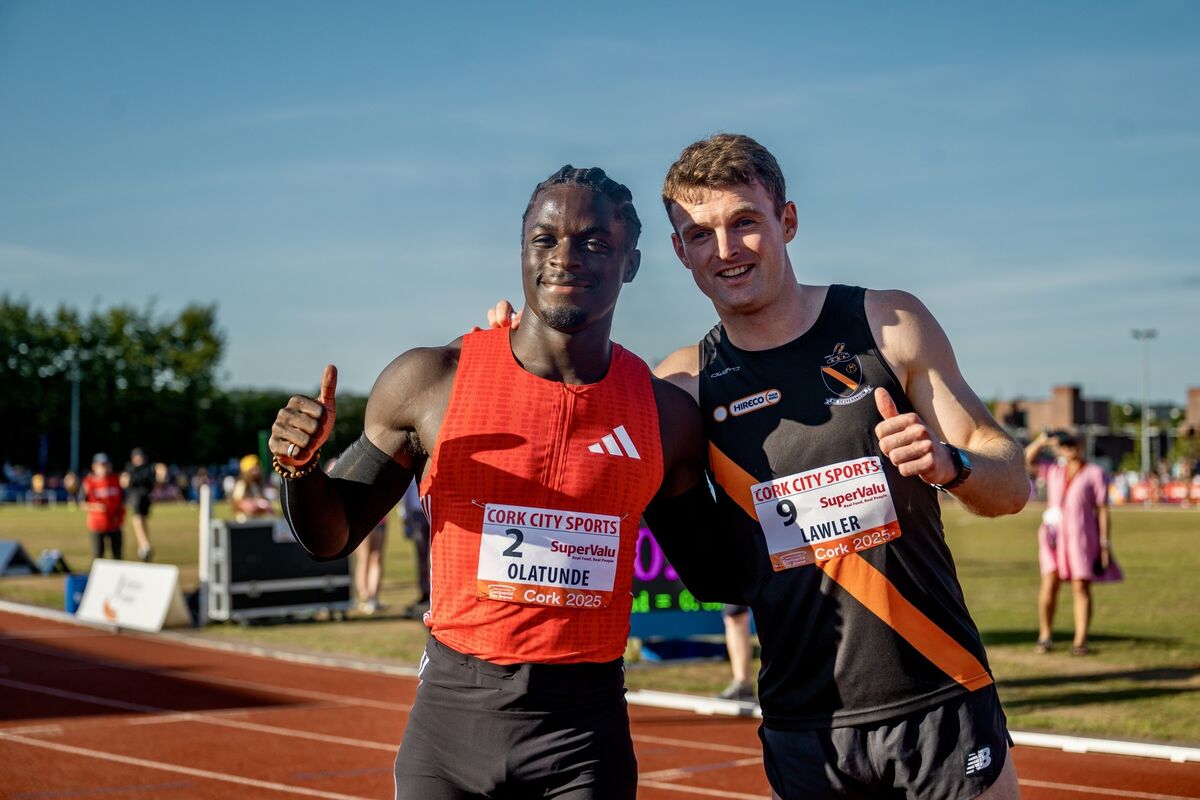 Fellow Irish athletes Israel Olatunde and Marcus Lawler smile arm in arm after competing together in the SuperValu 100 metres men’s Race 2, in which Olatunde claimed second place. Picture Chani Anderson. Fellow Irish athletes Israel Olatunde and Marcus Lawler smile arm in arm after competing together in the SuperValu 100 metres men’s Race 2, in which Olatunde claimed second place. Picture Chani Anderson.