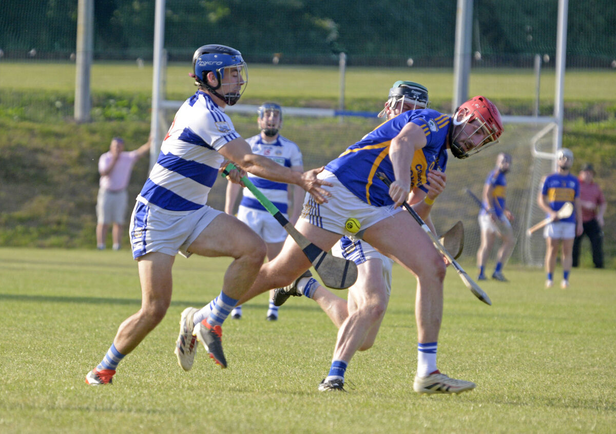 Killavullen's Charlie Lillis tackling Gearóid O'Donovan, Diarmuid Ó Mathúnas. Picture: Denis Boyle