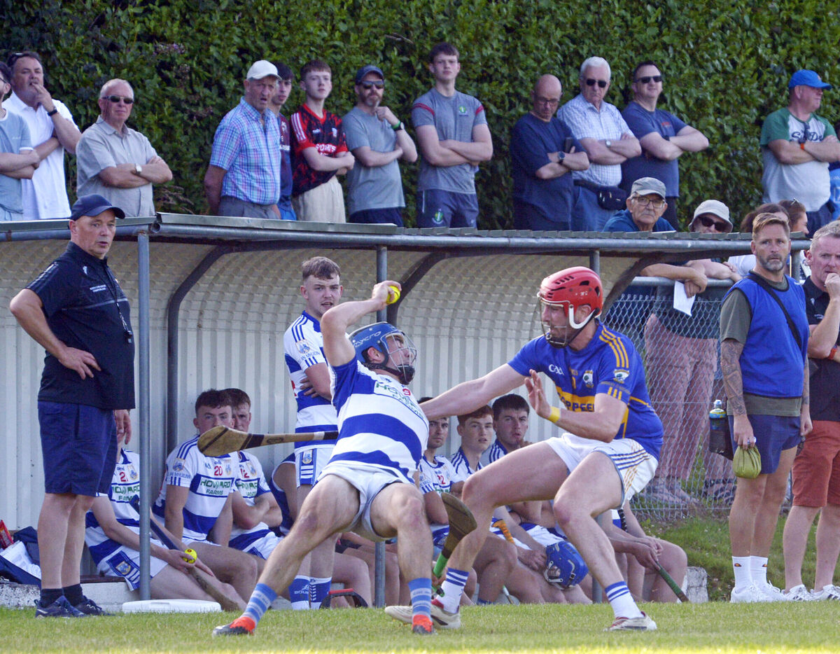 Killavullen's Charlie Lillis is brought down by Gearóid O'Donovan, Diarmuid Ó Mathúnas. Picture Denis Boyle