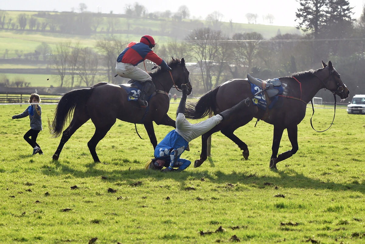 JW Hannon parts company from Turbo at the last fence, with his leg caught in the stirrup , wth Declan Queally on Kensukes Kingdom going on to win the maiden race for 5-Y-O geldings at Tallow point-to-point races in Conna in 2018. Picture: Eddie O’Hare
JW Hannon parts company from Turbo at the last fence, with his leg caught in the stirrup , wth Declan Queally on Kensukes Kingdom going on to win the maiden race for 5-Y-O geldings at Tallow point-to-point races in Conna in 2018. Picture: Eddie O’Hare