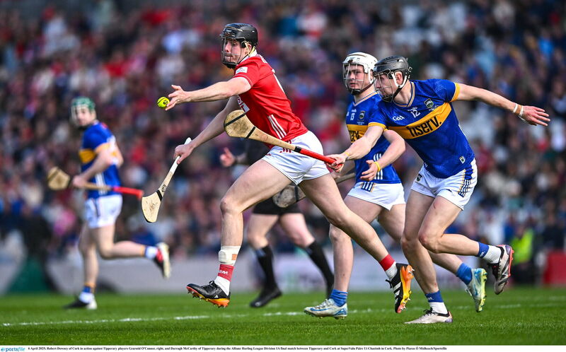 Robert Downey of Cork goes past Tipperary players Gearoód O'Connor and Darragh McCarthy. Picture: Piaras Ó Mídheach/Sportsfile