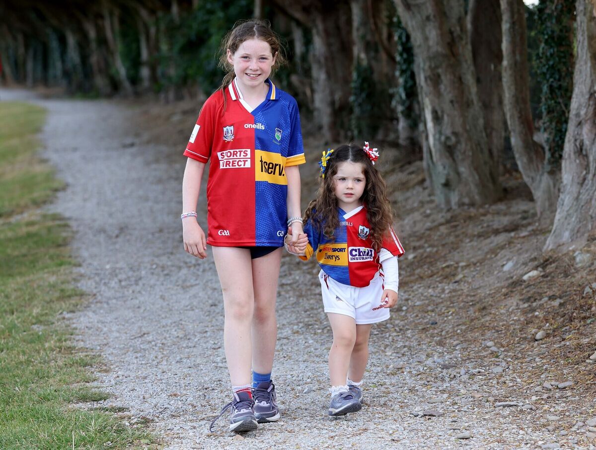 Sisters, Molly and Caoimhe O'Sullivan, with split loyalties for the upcoming hurling final. Picture: Jim Coughlan. Sisters, Molly and Caoimhe O'Sullivan, with split loyalties for the upcoming hurling final. Picture: Jim Coughlan.