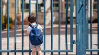 Child with bag back to school. Faceless cute little boy back to school with blue schoolbag