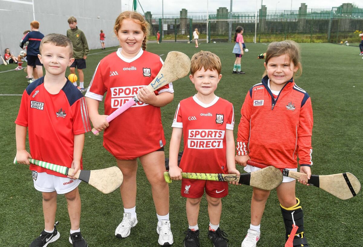  Keegan Hackett, Madison Cummins, Henry Hussey and Mia Ahern, are all smiles in their Cork jerseys at the St Vincent's GAA club cul camp. Picture: David Keane.