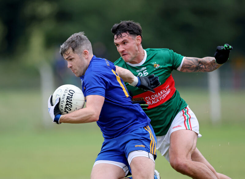  Adam Lyne, St.Finbarr's gets away from Thomas Clancy, Clonakilty for McCarthy Insurance Group Football League Division 1 Final at Ballygarvan. Picture: Jim Coughlan.