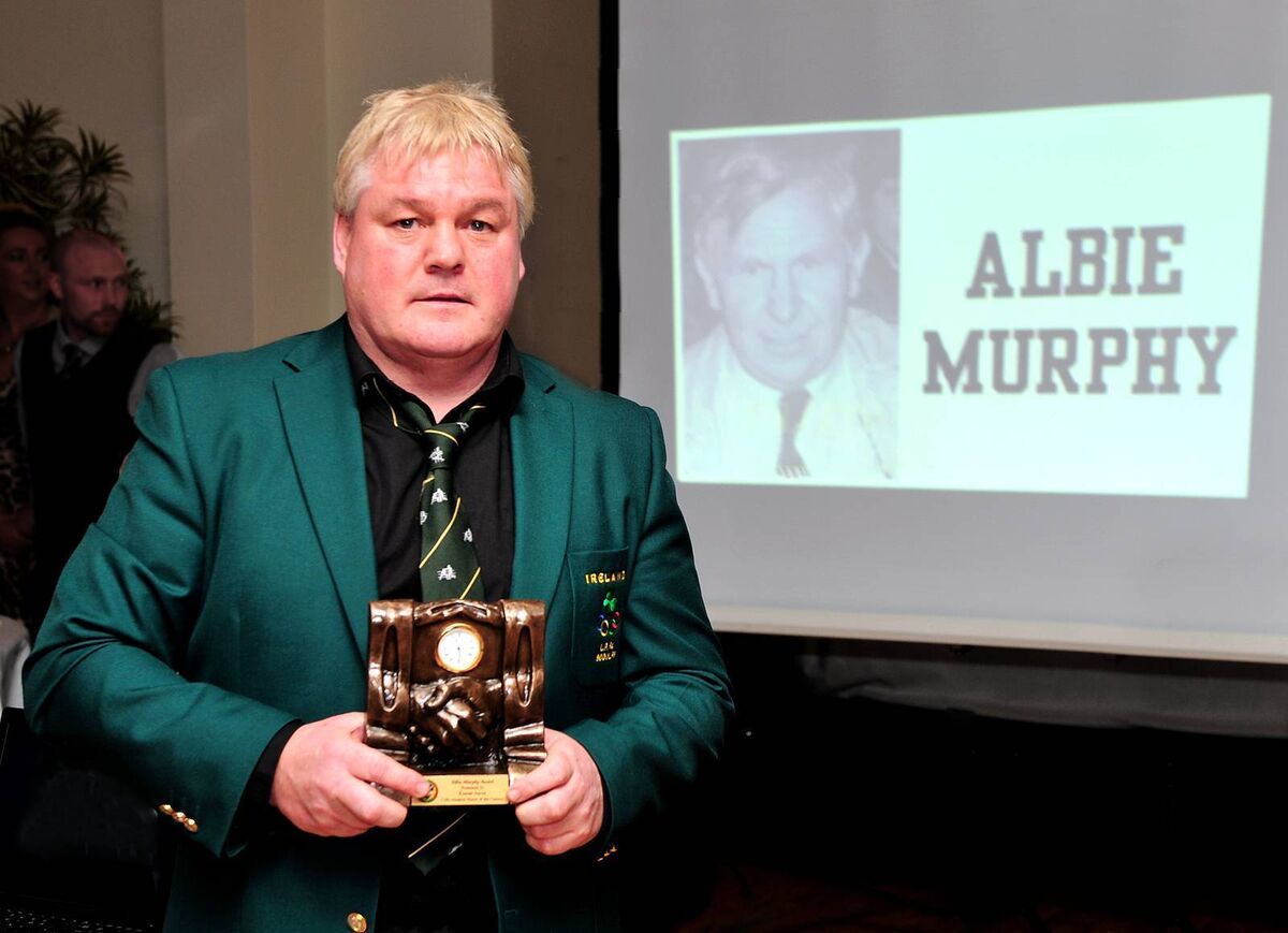 Kieran Joyce in front of a picture of his coach and mentor Albie Murphy, with his Cork Boxer Of The Century Award. Picture: Doug Minihane