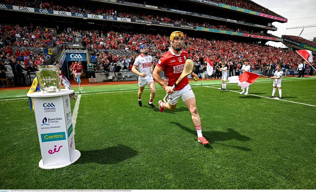 Declan Dalton of Cork runs onto the pitch past the Liam MacCarthy cup before the GAA Hurling All-Ireland Senior Championship final match between Cork and Tipperary at Croke Park in Dublin. Photo by Seb Daly/Sportsfile