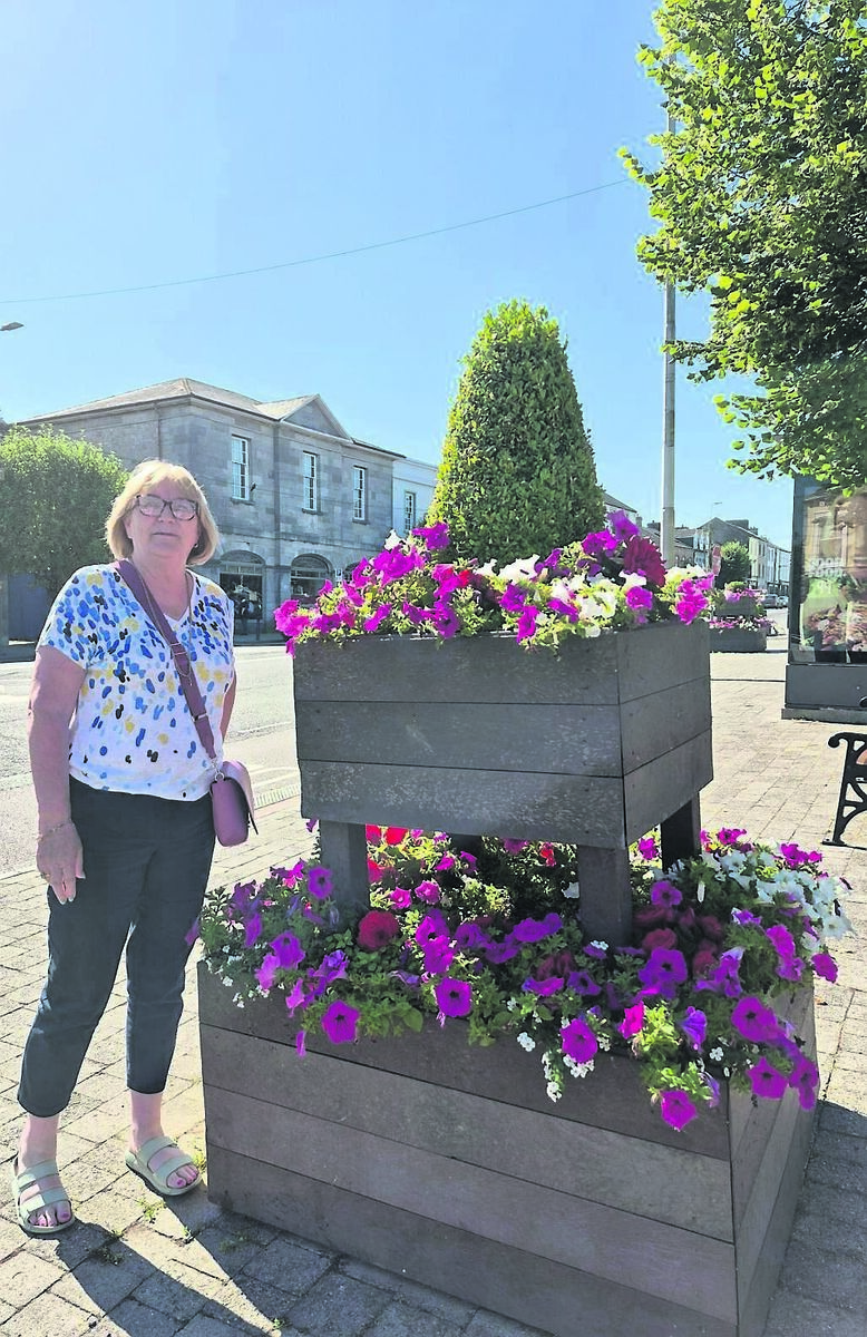 Local councillor Kay Dawson by a pretty plant structure in Mitchelstown - the place has a thriving tidy towns group.