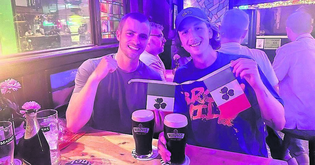 Enda Francis-Devine and his friend Conor Kavanagh stop off for a pint of Murphy’s at an Irish bar during their marathon cycling challenge