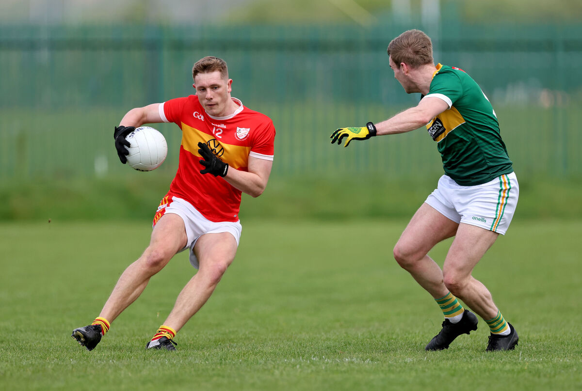Éire Óg's Jack Murphy tries to pass Daniel Meaney of St Michael's this season. Picture: Jim Coughlan