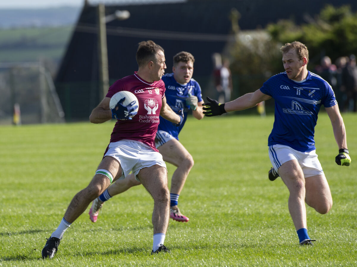 Bishopstown's Paul O'Flynn holds possession as David Daly of Bantry Blues closes him down during the 2021 Bon Secours Hospital SAFC relegation play-off in 2021. Picture: Dan Linehan