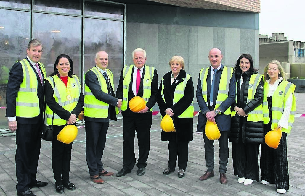 Denis Mulcahy Jr (left) and Denis Mulcahy, Project Children Chairman (centre), outside the Peace Campus in Monaghan with, from left, Cathy Bennett, TD, David Maxwell TD, Minister Heather Humphreys, Robert Burns, Chief Executive of Monaghan County Council, and charity advocates Linda Croston and Catherine Flood