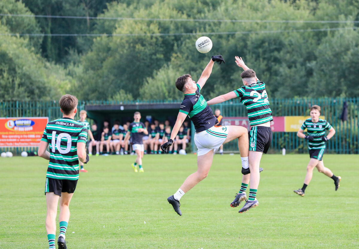 Nemo's Larry Butler and Douglas player Darragh O'Connor challenge for possession. Picture: David Creedon