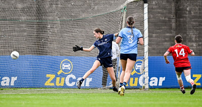Kate Carey of Cork, right, scores her side's third goal. Picture: Seb Daly/Sportsfile