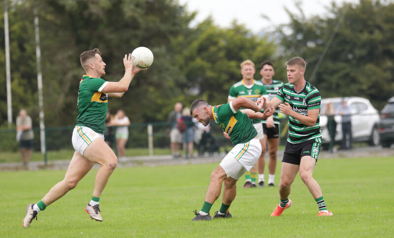 St Michael's Alan O'Callaghan bursts out of defence against Douglas. Picture: David Creedon
