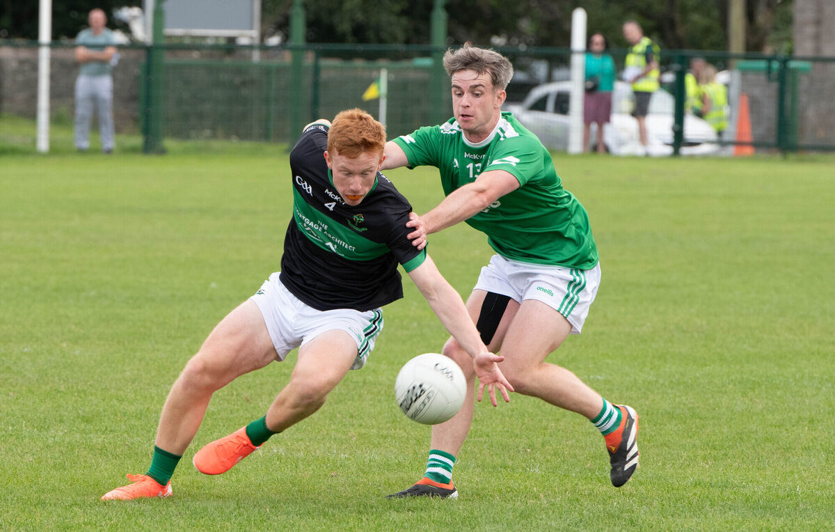 Nemo Rangers' Tim O'Brien and Aghada's Sean Morrissey tussle for possession. Picture: Howard Crowdy Nemo Rangers' Tim O'Brien and Aghada's Sean Morrissey tussle for possession. Picture: Howard Crowdy