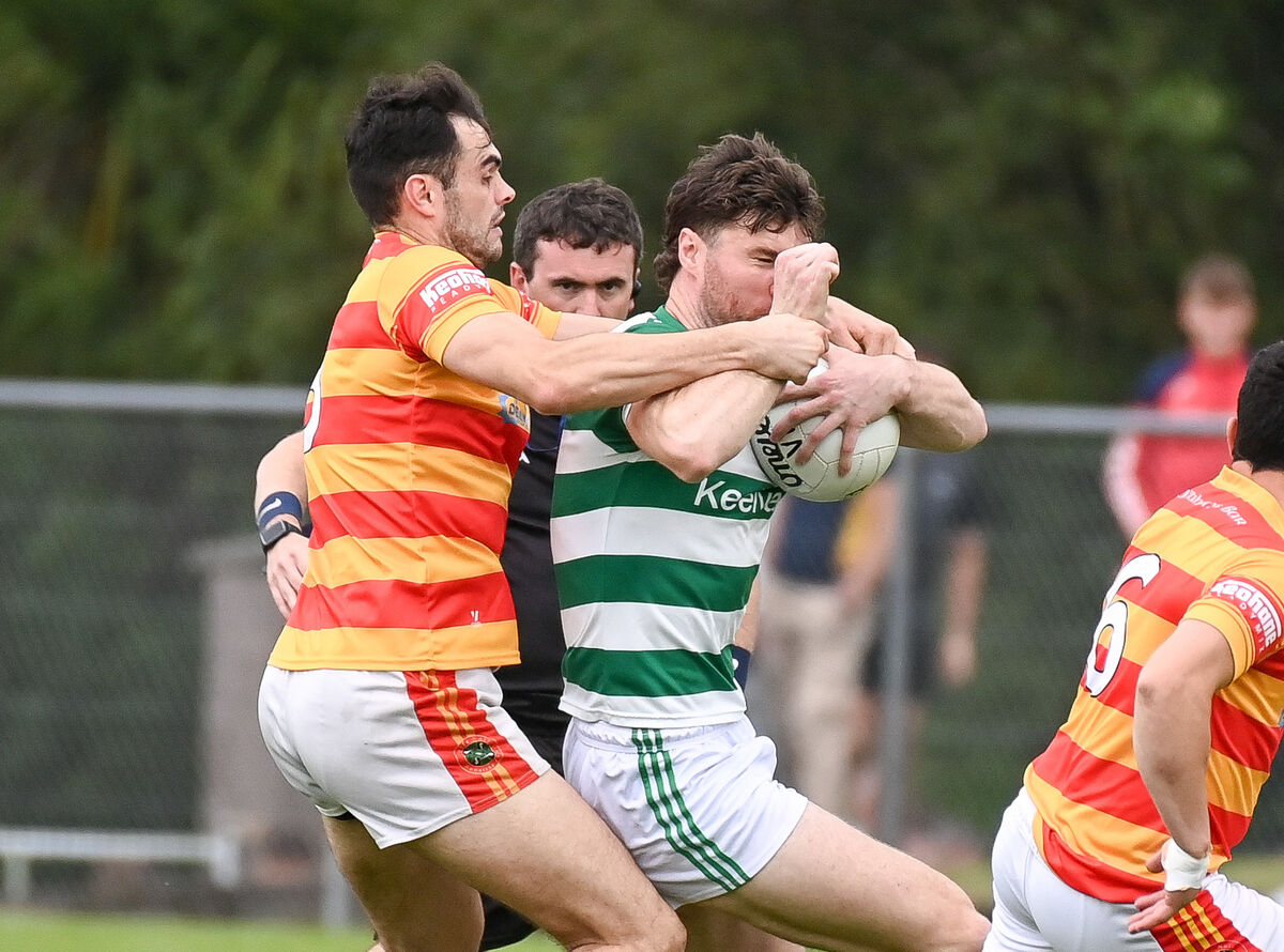  Referee John Ryan keeping a close eye on the tussle between Newcestown's Seán O'Donovan and Valley Rovers' Chris O'Leary. Picture: David Keane