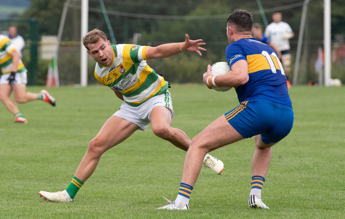 Carrigaline's Brian Coakley evades the challenge from Carbery Rangers' Jack Kevane. Picture: Howard Crowdy Carrigaline's Brian Coakley evades the challenge from Carbery Rangers' Jack Kevane. Picture: Howard Crowdy