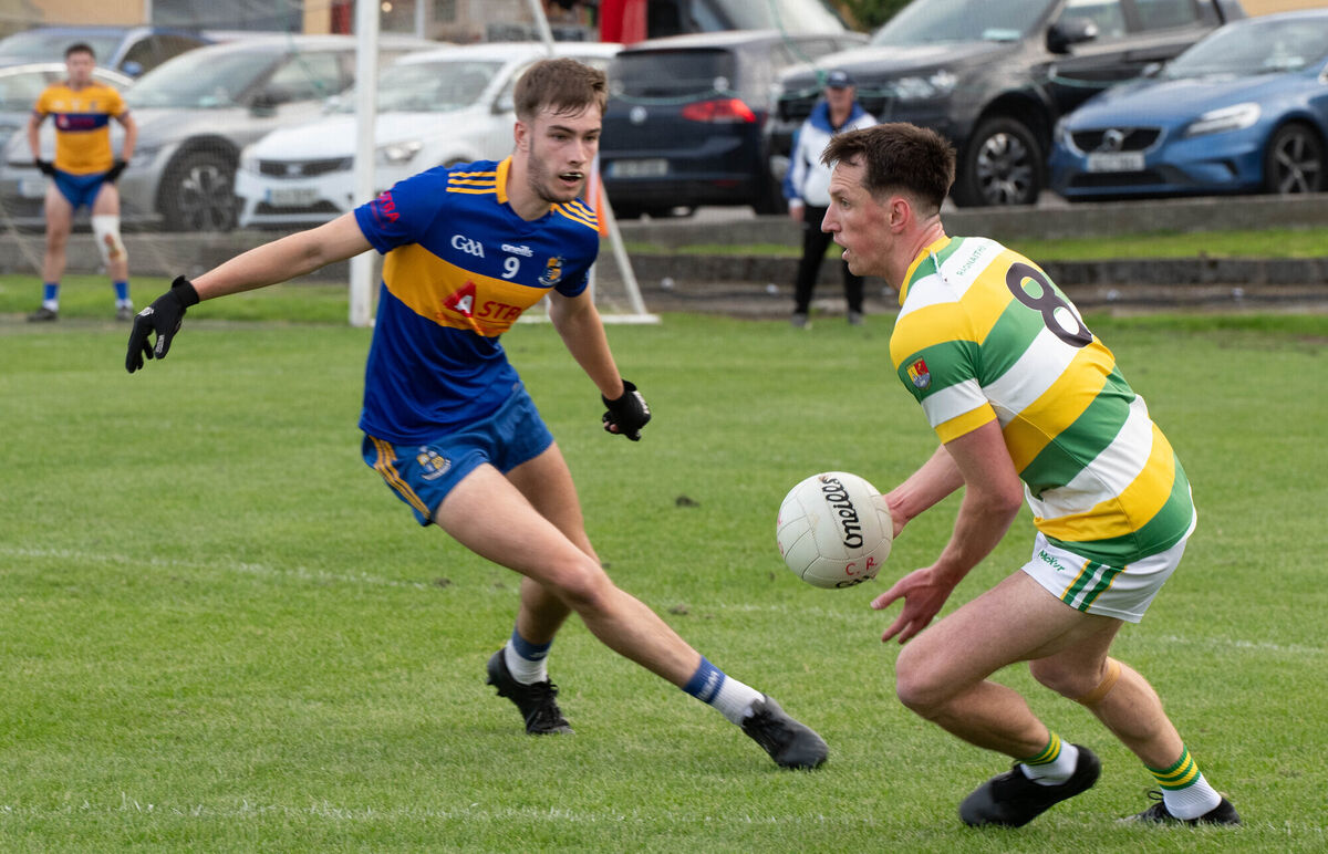 Carbery Rangers' Brian Hodnett about to pass the ball despite the attention from Carrigaline's Nathan O'Keeffe. Picture: Howard Crowdy Carbery Rangers' Brian Hodnett about to pass the ball despite the attention from Carrigaline's Nathan O'Keeffe. Picture: Howard Crowdy