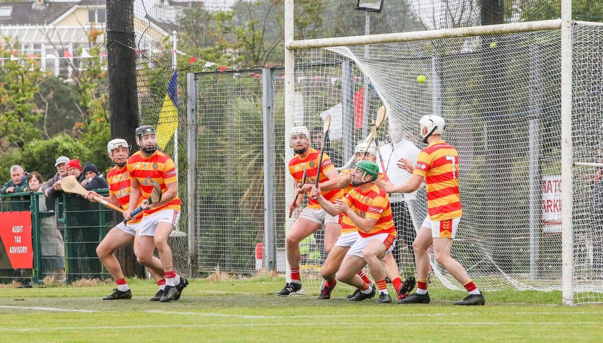 A shot from Fr O'Neill's Declan Dalton flies past the the Newcestown defence and into the net. Picture: David Creedon