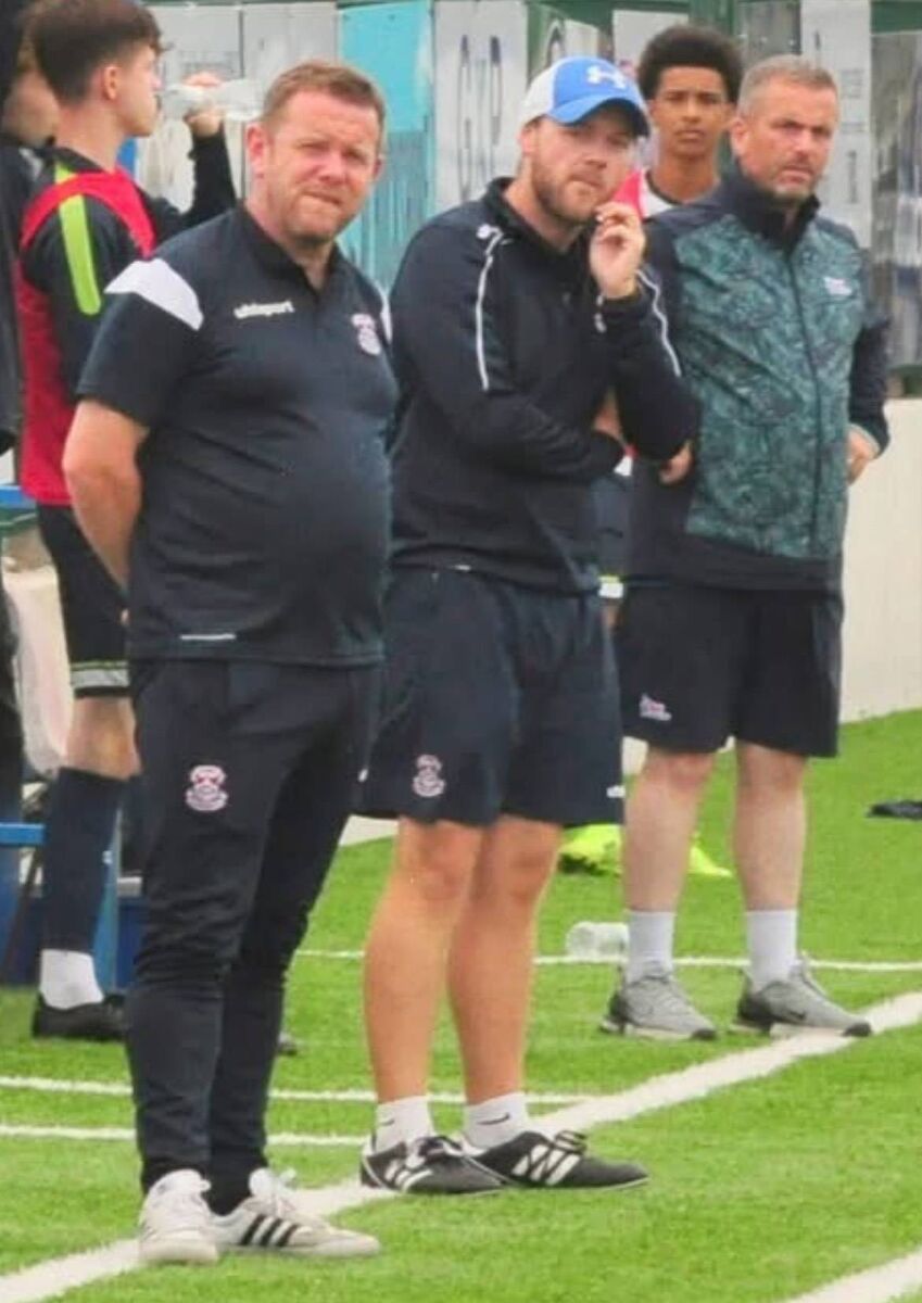 Cobh Ramblers U17 manager Derek O'Donovan and Stephen O'Keeffe look on at a game.