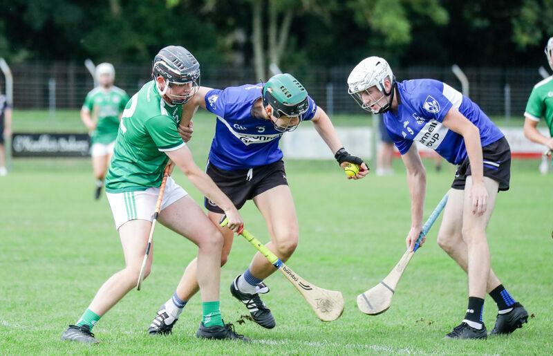  Sarsfields' Eoin Considine in a tussle with Ballincollig's Patrick McCarthy. Picture: David Creedon