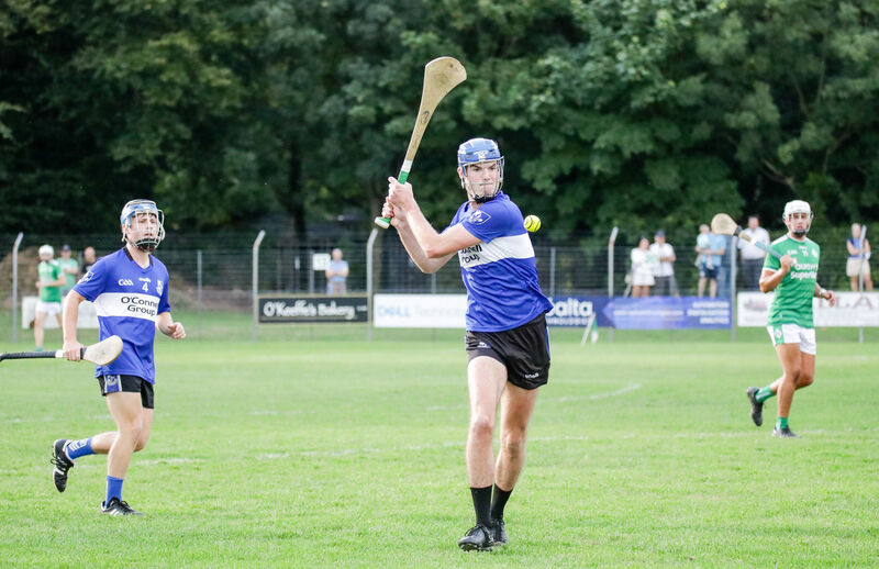 Sarsfields' Rory Higgins clears the ball against Ballincollig. Picture: David Creedon