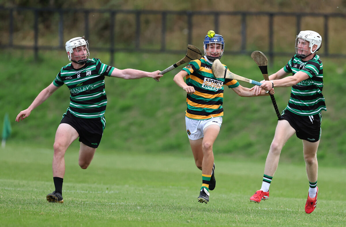 Kyle Foley, Glen Rovers, runs at Jack O'Brien and James Gordon, Douglas. Picture: Jim Coughlan.