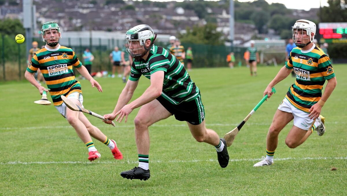 Craig Turnbull and Evan McGuckin, Glen Rovers, close in on Joe Mouret, Douglas. Picture: Jim Coughlan.