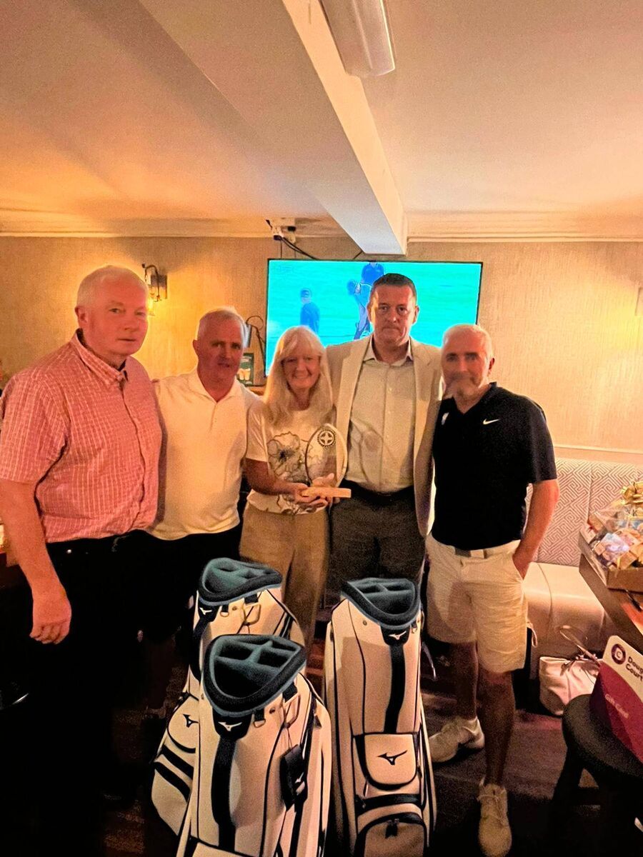 At the Rochestown GAA Club Golf Classic, Michael Corkery (far left), club chairperson, Noelle Corkery (centre) and Declan Murphy of the organising committee (second from right) presenting first prize of the Murphy Cup to the winning team, representing Carrigaline Joinery - John O'Neill and Brian O'Neill. Missing is the third team member, Ruairí Dwyer.