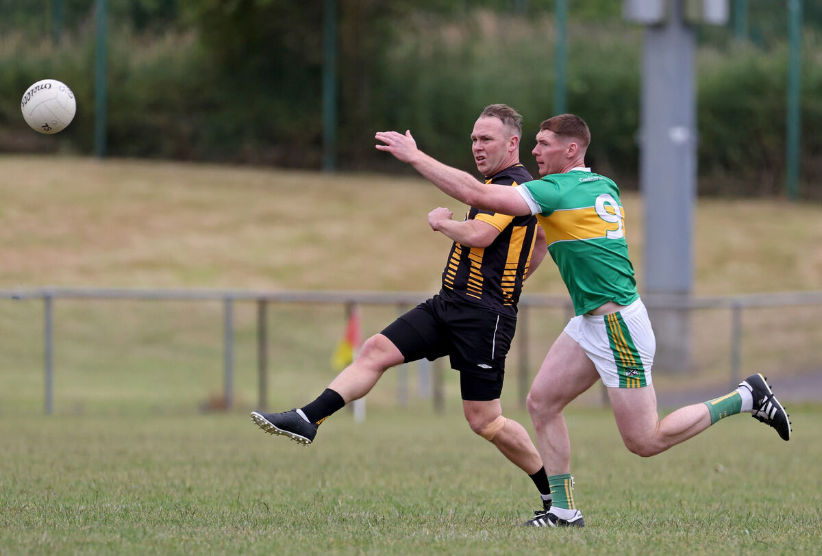Paul Hartnett of Rochestown gets his shot away as Castlelyons' Shane Moroney closes in during the McCarthy Insurance Group JCFC final at Mallow last month. Picture: Jim Coughlan