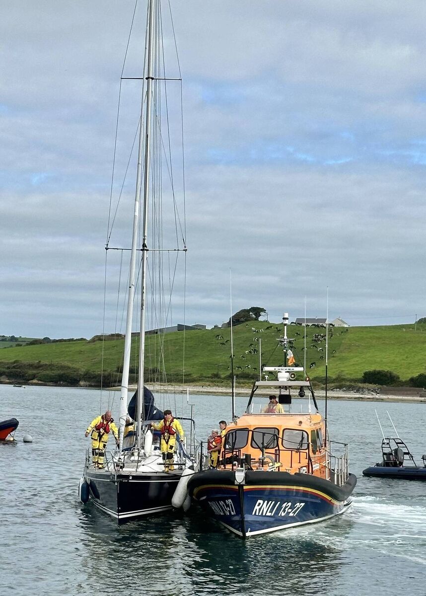 The Lifeboat arriving back to Courtmacsherry with the yacht in tow alongside. 