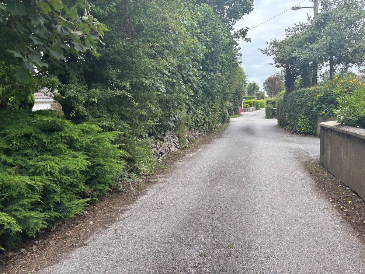 The narrow road that 20 families live on. The narrow road that 20 families live on.