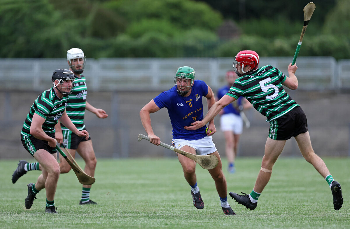 Ben Cunningham of St Finbarr's holds possession as Eoin O'Flynn of Douglas closes in. Picture: Jim Coughlan Ben Cunningham of St Finbarr's holds possession as Eoin O'Flynn of Douglas closes in. Picture: Jim Coughlan