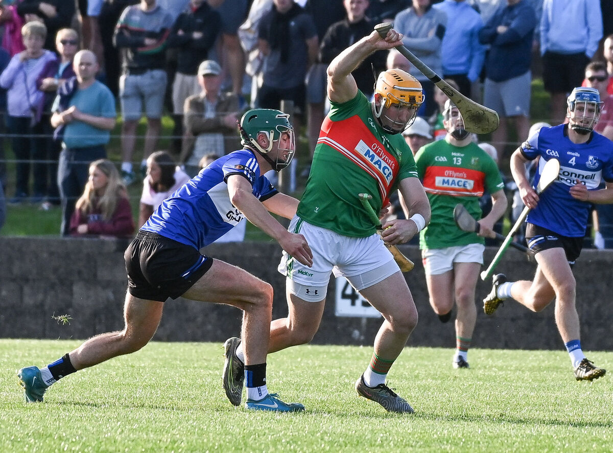 Sarsfields' Cillian Roche loses his hurley as he tries to halt the progress of Fr O'Neill's Declan Dalton, during their Premier SHC clash at Carrigtwohill. Picture: David Keane.