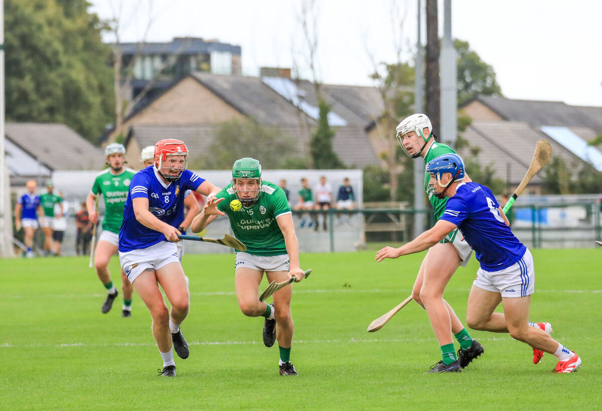 Ballincollig's Seán O'Neill tries to break away from Ballinhassig's Charlie Grainger. Picture: David Creedon