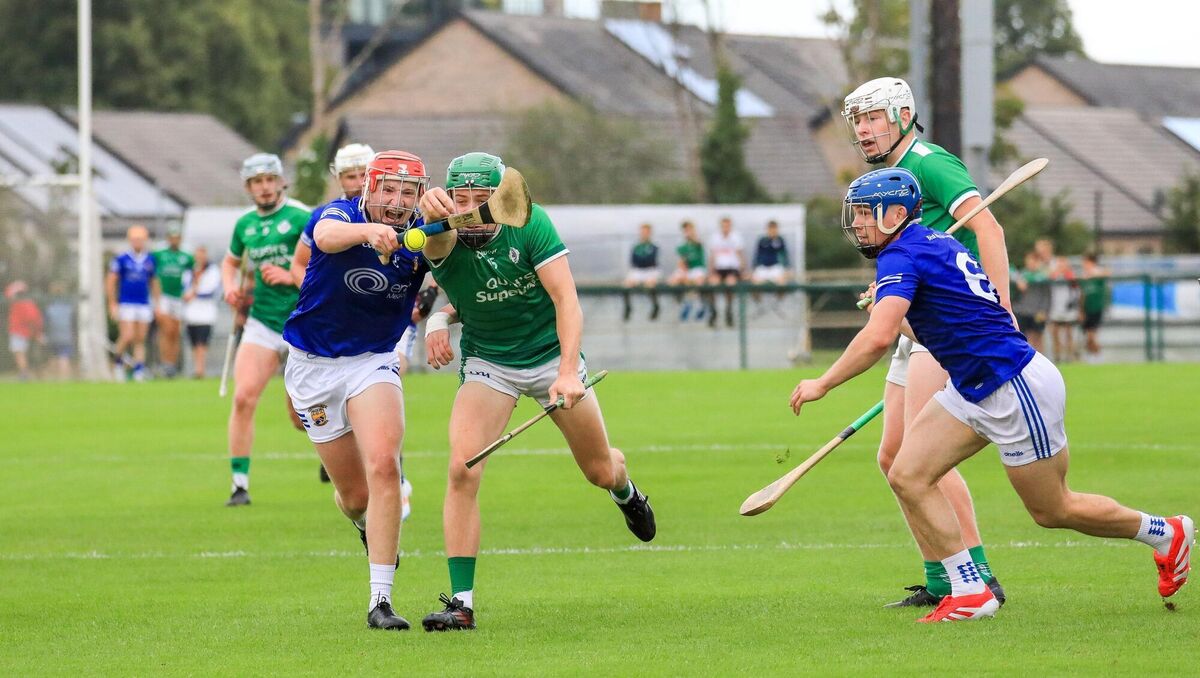 Ballinhassig's Charlie Grainger and Ballincollig's Seán O'Neill tussle for the ball. Picture: David Creedon