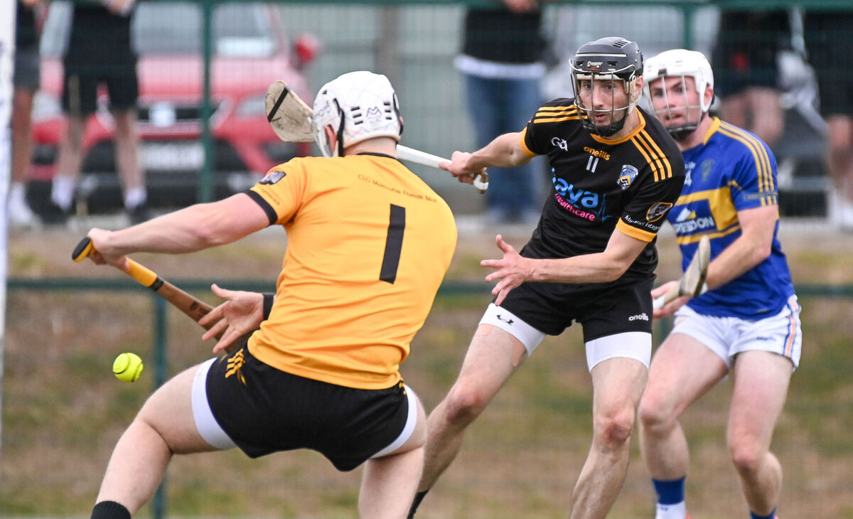 Carrigtwohill's James Mulcahy hammers the ball to the Fermoy net past Brian O'Sullivan and Shane Coughlan. Picture: David Keane. Carrigtwohill's James Mulcahy hammers the ball to the Fermoy net past Brian O'Sullivan and Shane Coughlan. Picture: David Keane.