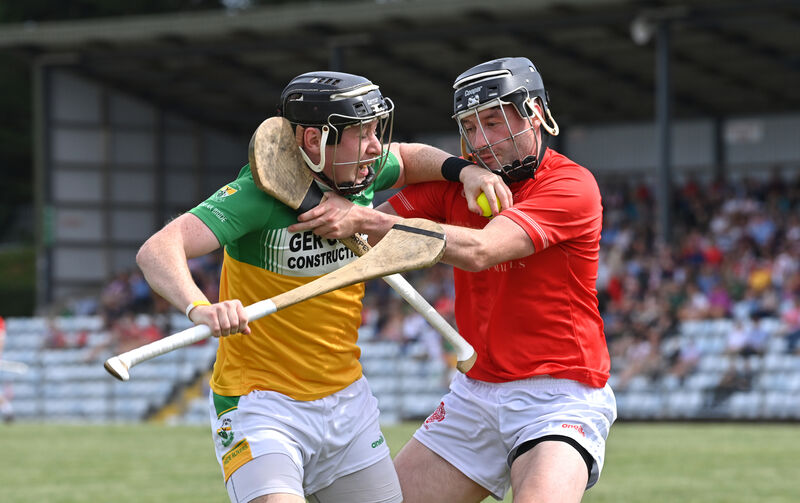 Conor Barry of Bride Rovers tries to escape the clutches of Blarney's Alan McEvoy. Picture: Dan Linehan