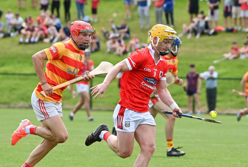  Charleville's Jack Callaghan races past Newcestown's Richard O'Sullivan during their Premier SHC clash at Grenagh. Picture: David Keane