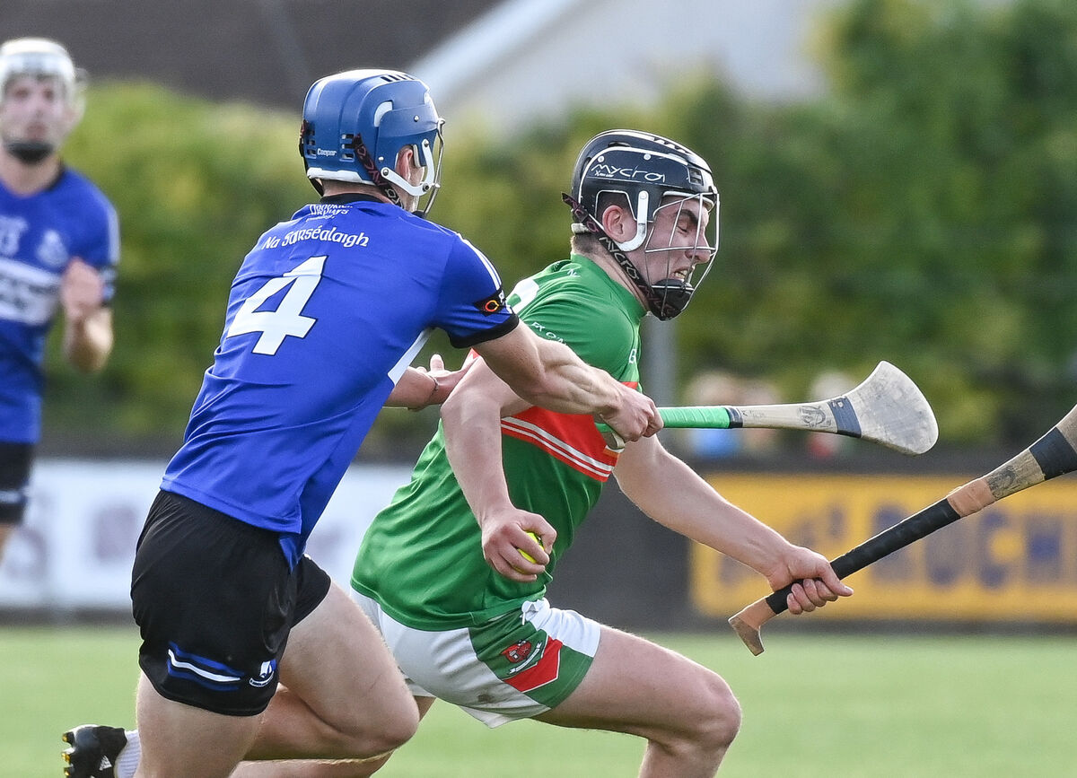  Fr O'Neill's John Millerick is tackled by Sarsfields' Cathal McCarthy, during their Premier SHC clash at Carrigtwohill. Picture: David Keane.