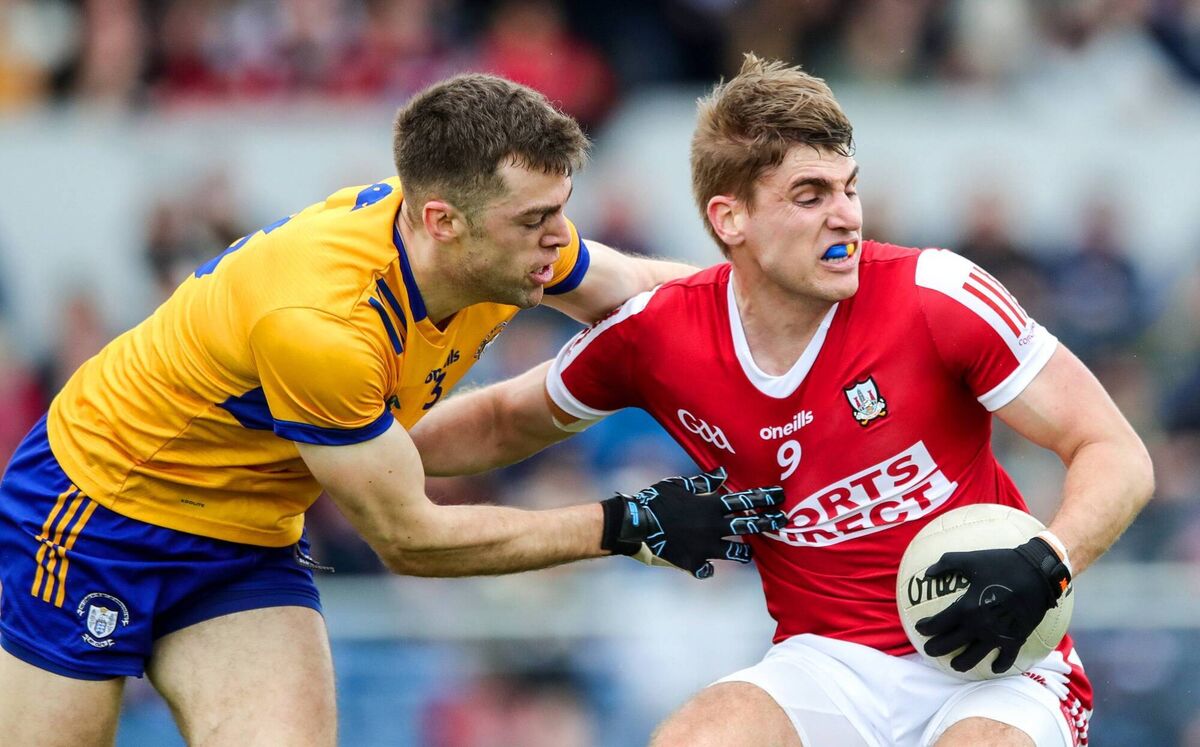 Ian Maguire of Cork with Cillian Brennan of Clare in their 2023 Munster championship clash. Picture: INPHO/Natasha Barton