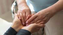 Hands of a mature woman or caregiver of care and support. Close-up.