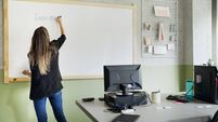 Female professor writing on the whiteboard