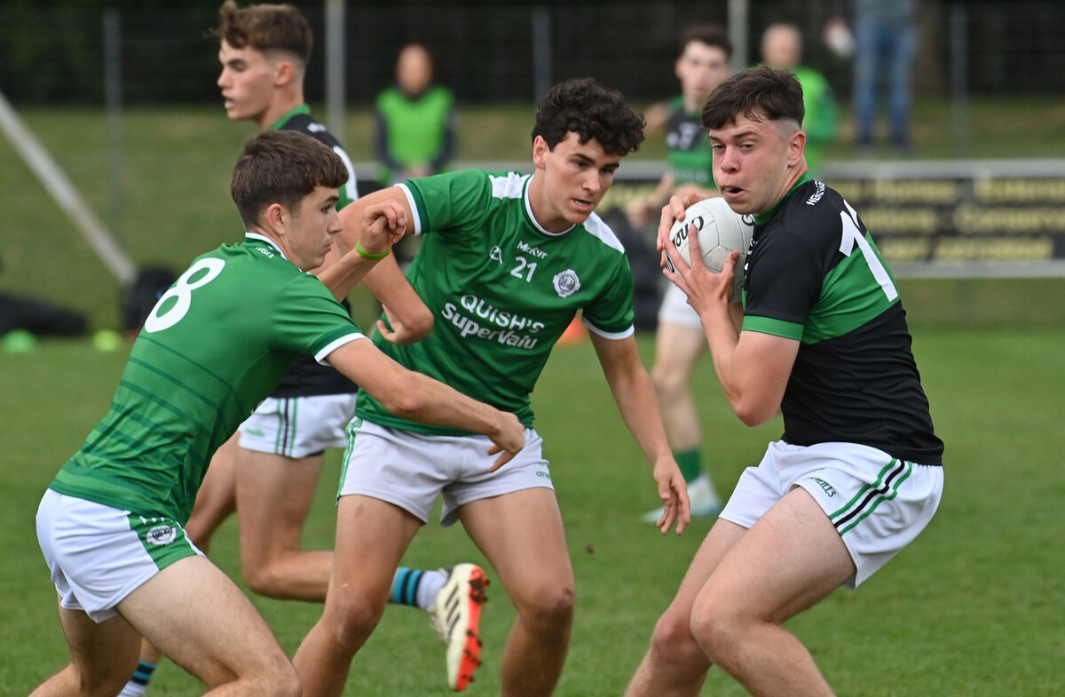  Ballincollig players Kevin O'Leary and Joe Miskella looking to block the run of Larry Butler of Nemo Rangers in their Rebel Óg P1 MFC match at Ballincollig. Picture: Dan Linehan