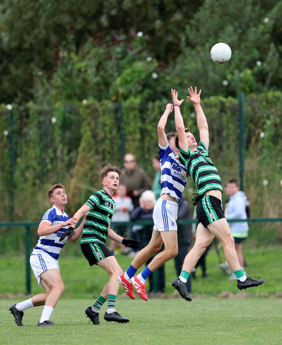  Liam Kelleher, Douglas, battles for the high ball with Gerard Murphy, Kinsale. Picture: Jim Coughlan.