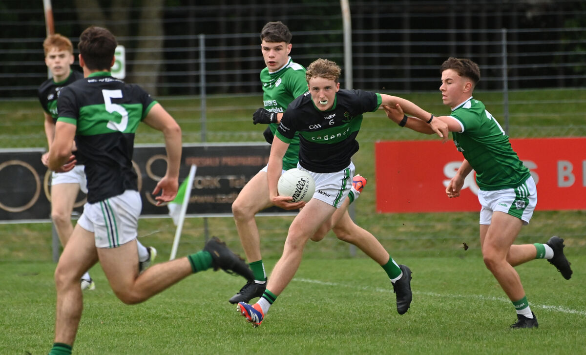  Cian Ahern, Ballincollig, holding onto Cian Power, Nemo Rangers, in their Rebel Óg P1 MFC match at Ballincollig. Picture: Dan Linehan