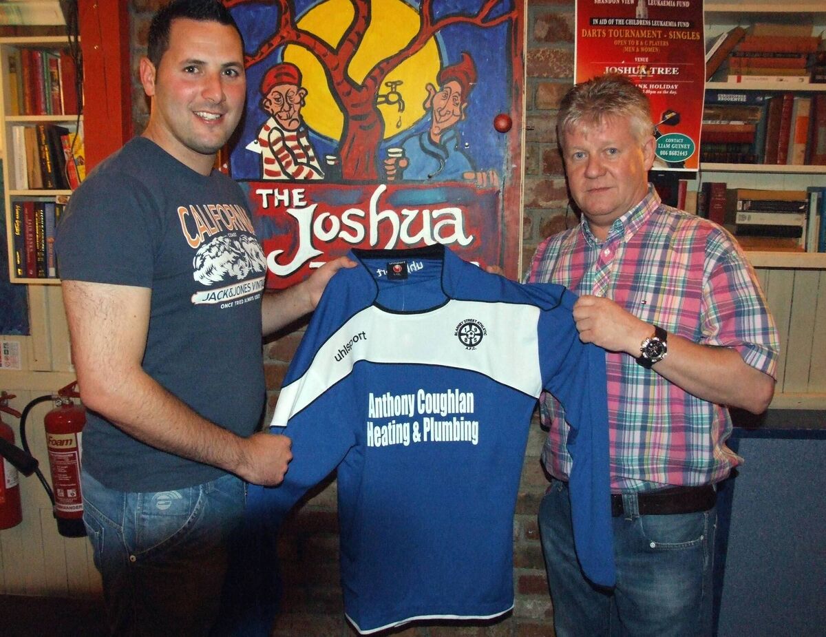 Eddie Kenny (Manager Blarney Street Athletic) is presented with a new set of gear by Anthony Coughlan (Coughlan Heating and Plumbing) for the new season. /Barry Peelo.