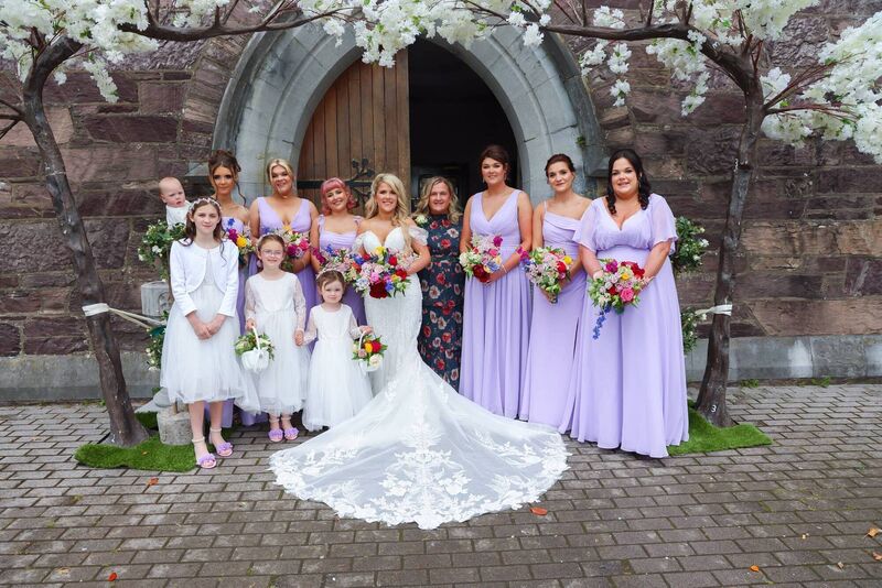 Victoria pictured on her wedding day with her bridal party. 